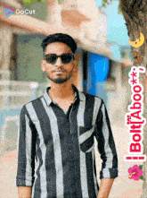 a man wearing sunglasses stands in front of a tree with a sticker that says bolt aboo on it