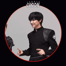 a man in a black jacket is standing in a circle with the word choom above him