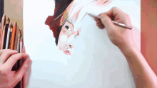 a person is drawing a picture with a pencil