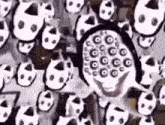 a black and white drawing of a clown surrounded by a bunch of skulls .