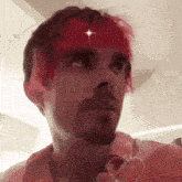 a man with red hair and a beard has a heart on his shirt