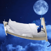 a narwhal is laying in a bed with a full moon behind it