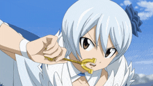 a girl with white hair is holding a golden key in her mouth
