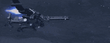 a jet is flying through the air with a blue light coming out of it 's engines