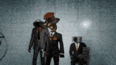 a man with a top hat on his head stands next to two other men in suits