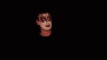 a close up of a person 's face with the number 90 visible
