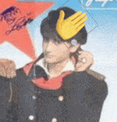 a man wearing a hat with a hand on it
