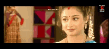 a close up of a woman 's face with the words telugu cinema zone at the bottom