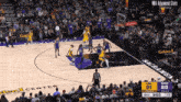 a basketball game is being played in front of a crowd at the golden 1 center