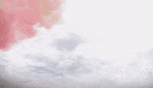 a rainbow of colors is coming out of a cloudy sky