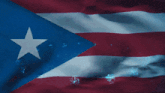 a red white and blue flag with a white star in the middle