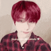 a young man with red hair is wearing a plaid shirt and has the words jisung solo de melody above him