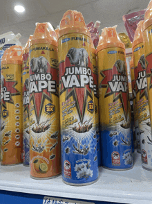 several cans of jumbo vape sit on a shelf in a store