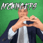 a man in a suit and tie is making a heart shape with his hands and the words afcwinger 's are above him