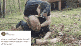 a man is laying on the ground while another man holds his head in the air .