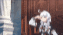 a blurry picture of a anime girl standing in front of a door .