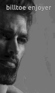 a black and white photo of a man with a beard and the words billtoe enjoyer