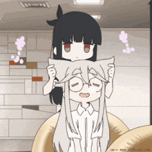 a cartoon of a girl holding a pillow over another girl 's head with chinese writing on the bottom right corner