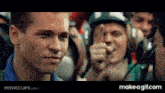 a man giving a thumbs up in a movie clip