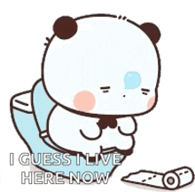 a panda bear is sitting on a toilet holding a roll of toilet paper and a tissue .