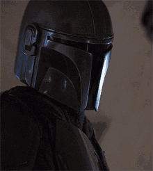 a close up of a person wearing a helmet with the letter o on it