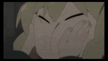 a close up of a cartoon character covering her face with her hands