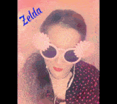 a woman wearing sunglasses with flowers on her ears has the name zelda written above her