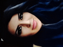 a close up of a woman 's face with her eyes closed