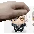 a hand is holding a stuffed animal over another stuffed animal on a white background .