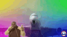 a man is standing in front of an airplane with a rainbow colored background ..