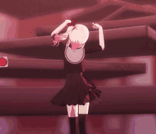 a girl in a black dress is dancing with her hands up