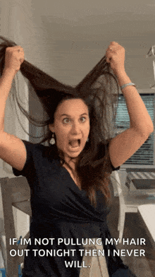 a woman is pulling her hair out with a caption that says if im not pulling my hair out tonight then i never will ..