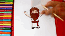 a person is drawing a cartoon of jesus with a red belt