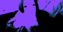 a woman 's face is visible in a green and black photo
