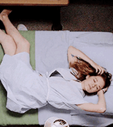 greys anatomy april kepner laying down hospital bed bored