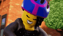 a lego character wearing a blue and pink helmet