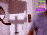 a man in a blue shirt is standing in front of a door and a sign that says 80 90 fantasticlandia