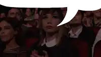 a woman with a speech bubble above her head watches a movie