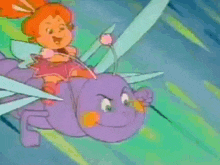 a little girl is riding on the back of a bug