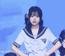 a girl in a sailor uniform has a chinese symbol on her shirt