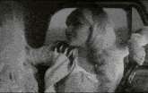 a woman in a car with a headband that says ' anna ' on it