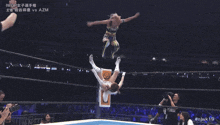 a woman in a wrestling ring with chinese writing