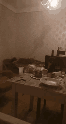 a table in a living room with a plate on it that says ' coca cola ' on it