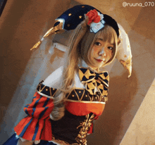 a woman in a jester costume has the hashtag @ruuna_070 on the bottom right