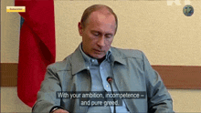 a man sitting in front of a microphone with the words " with your ambition incompetence and pure greed " on the screen