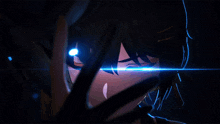 a close up of a person 's eyes with a blue light coming out of them