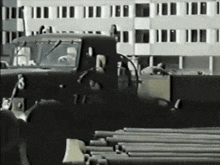 a black and white photo of a military vehicle with the number 11 on the side