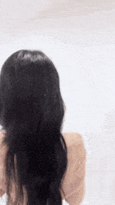 the back of a woman with long black hair