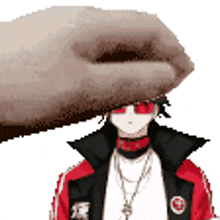 a hand is putting something on a person 's head .