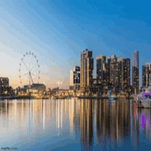 a city skyline with a ferris wheel in the middle